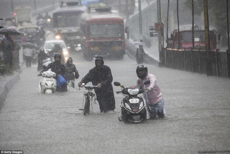 two toddlers are among at least 14 dead in mumbai floods