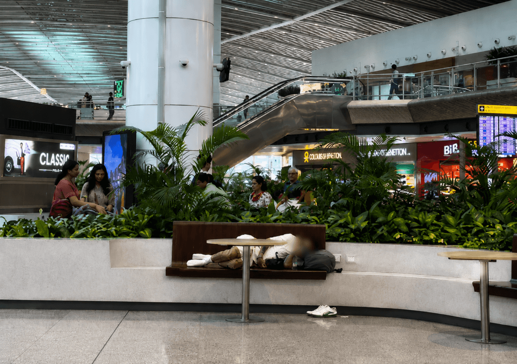 Delhi Airport Bench Post Sparks Online Backlash After Man Calls Sleeping Passenger “Uncivilised”